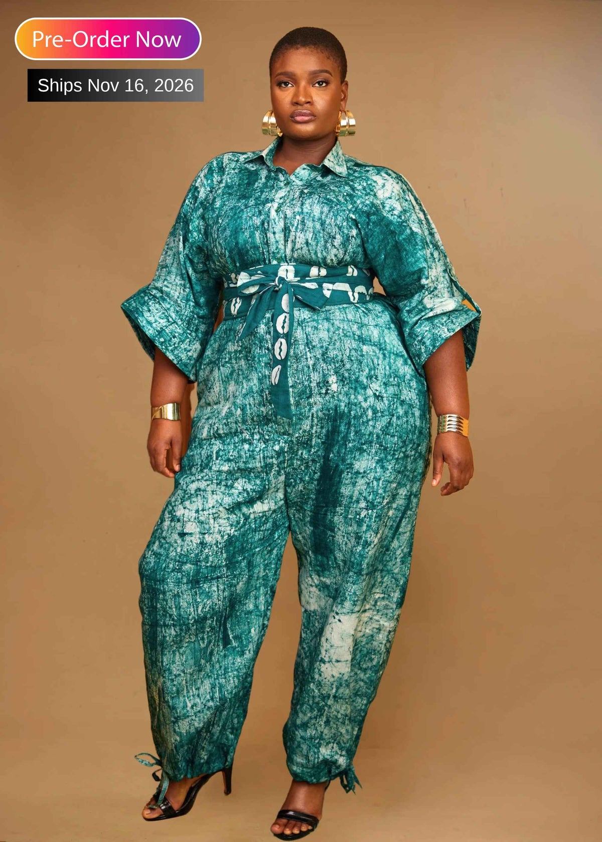 Woman wearing the Splash hand-dyed batik jumpsuit with balloon legs – African print cotton jumpsuit by Zanaani