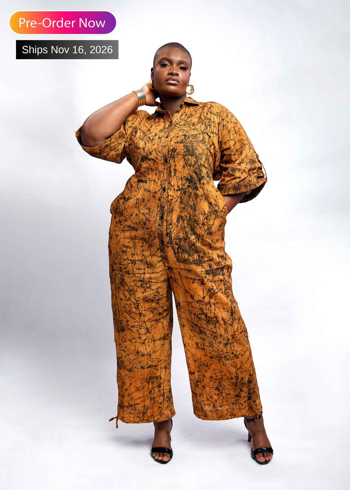 Woman wearing the Writing hand-dyed batik wide-leg jumpsuit – African print cotton jumpsuit by Zanaani